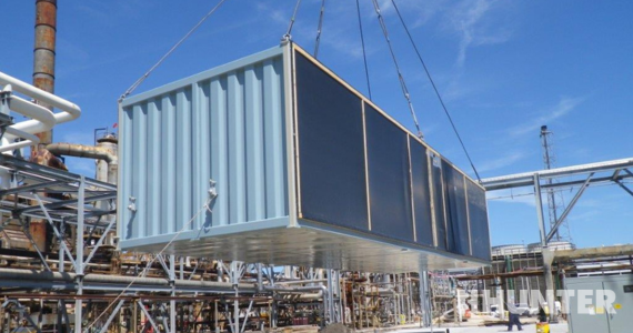 Modular building being lowered at construction site